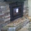 fireplace installation - veneer stack stone being applied 